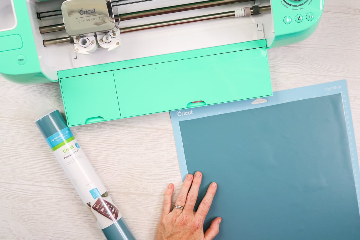 adding vinyl to a cricut mat