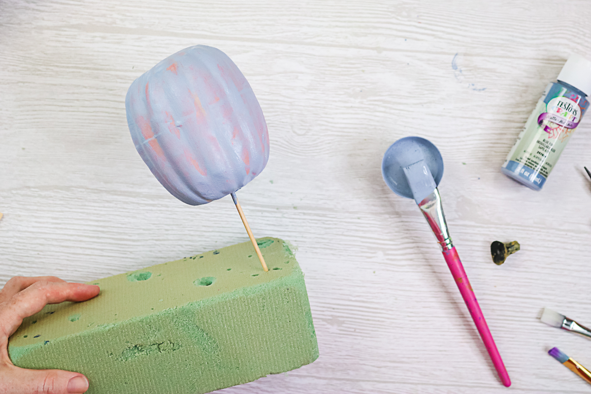 adding textured paint to pumpkins