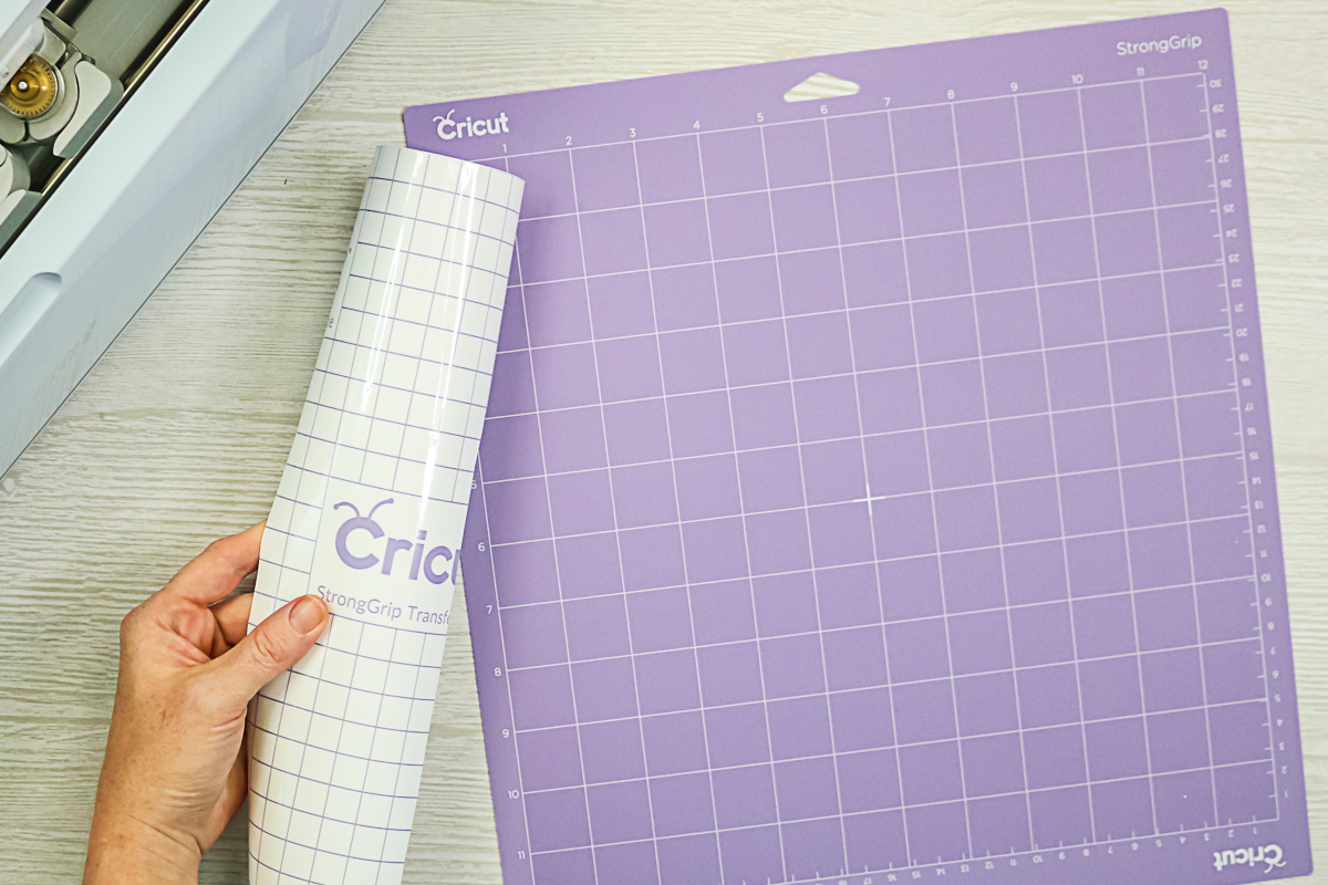 adding strong grip transfer tape to the strong grip cricut mat