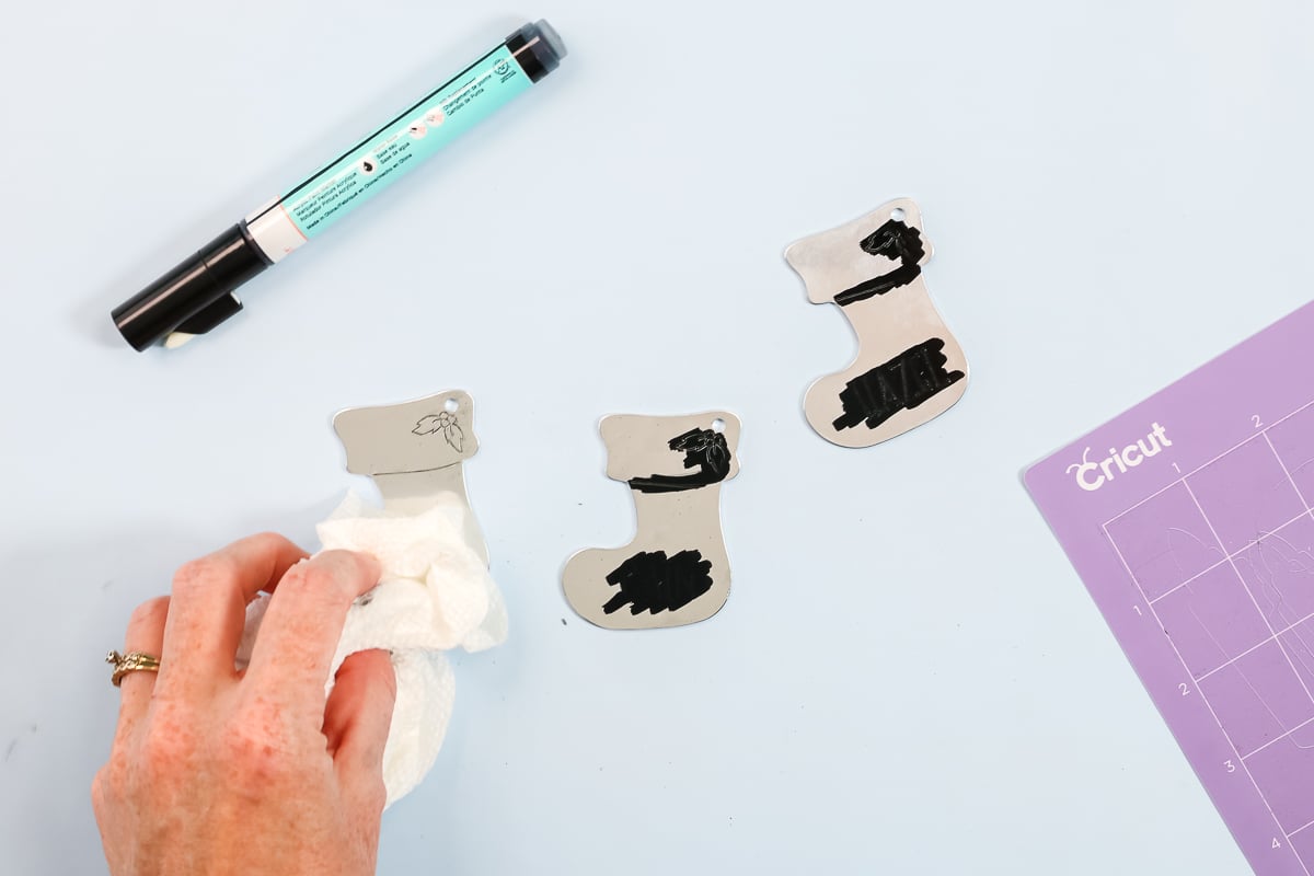 removing stamp enamel marker with a paper towel