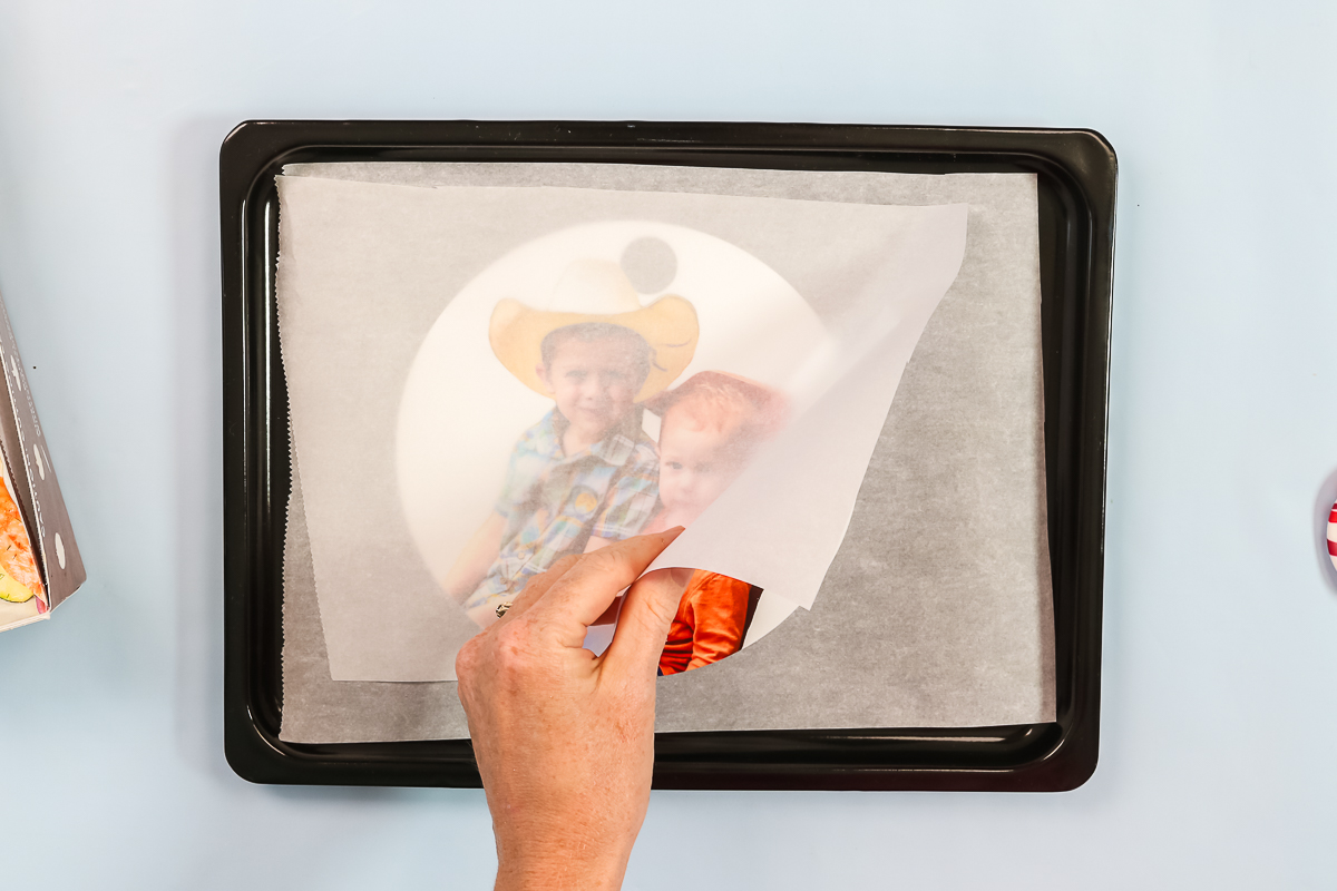 covering shrink film with parchment paper in an oven