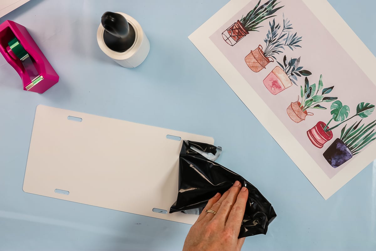 removing protective film from sublimation license plate