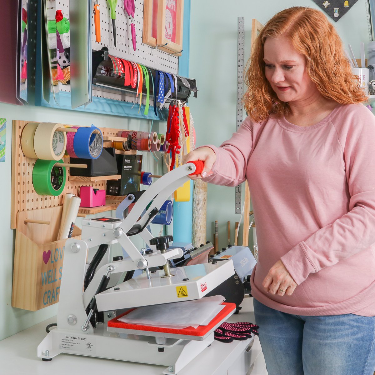 angie holden with a heat press