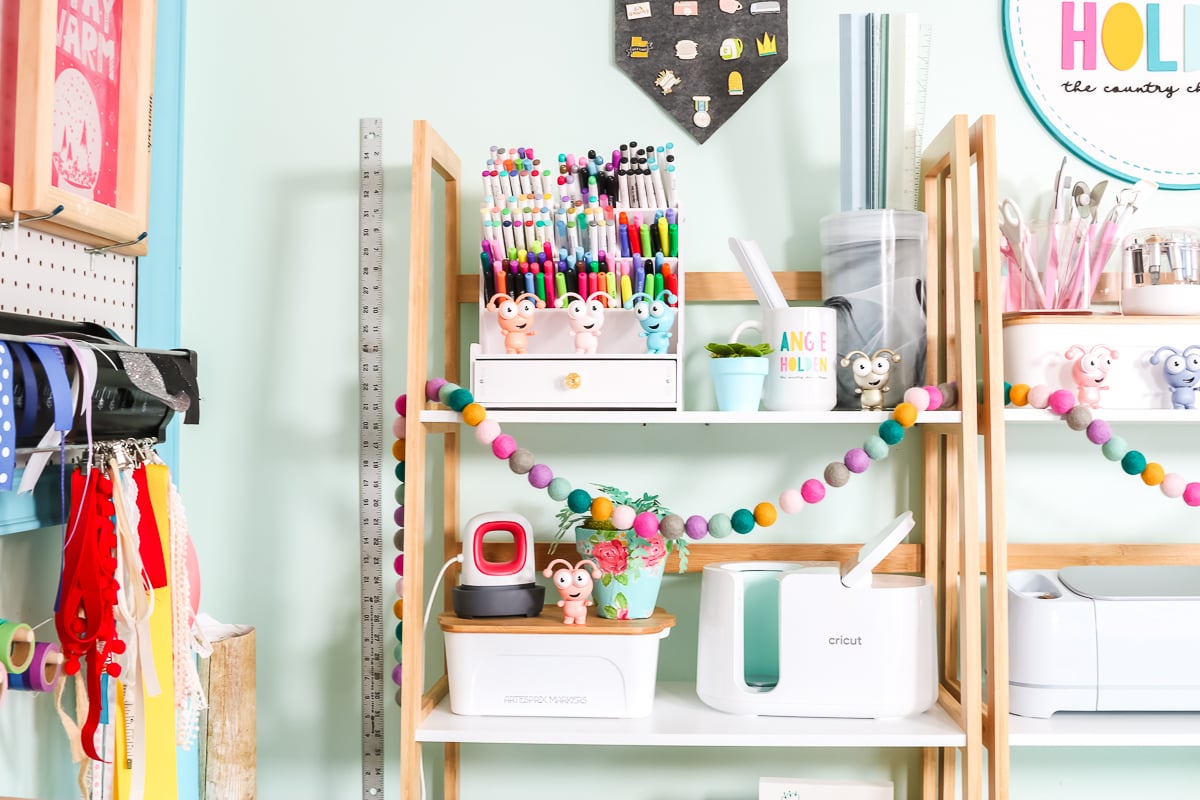 organized shelves in a cricut craft room