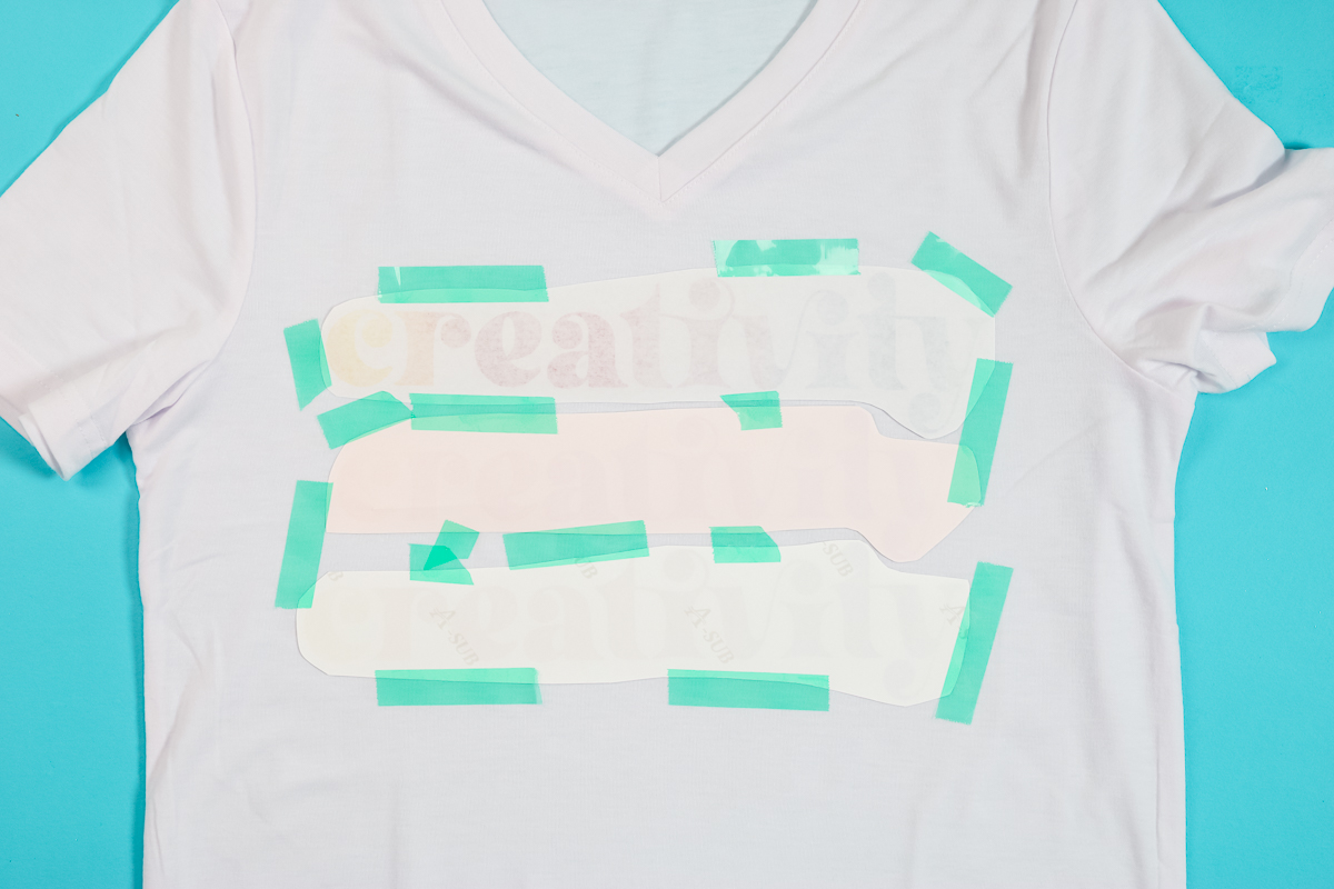 taping designs onto a polyester shirt