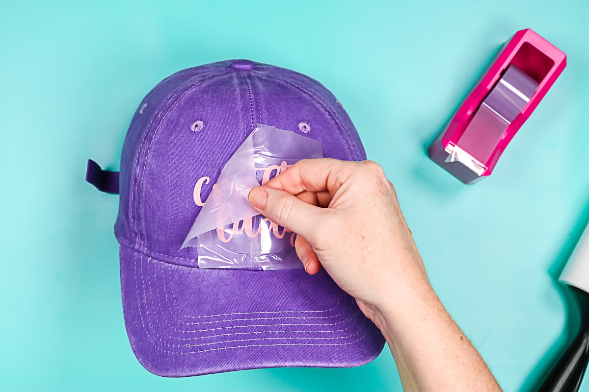 peeling back carrier sheet from a hat