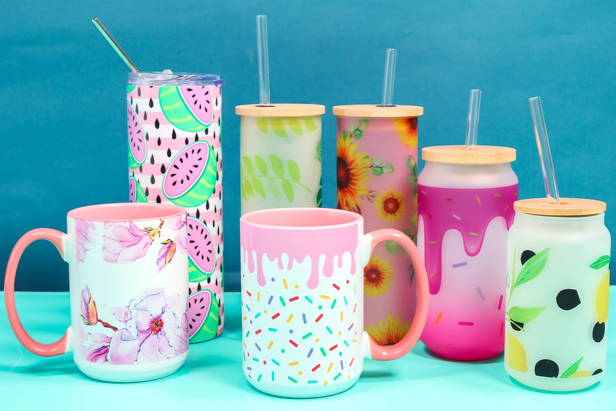 Variety of mugs and tumblers sublimated with a variety of sublimation images.