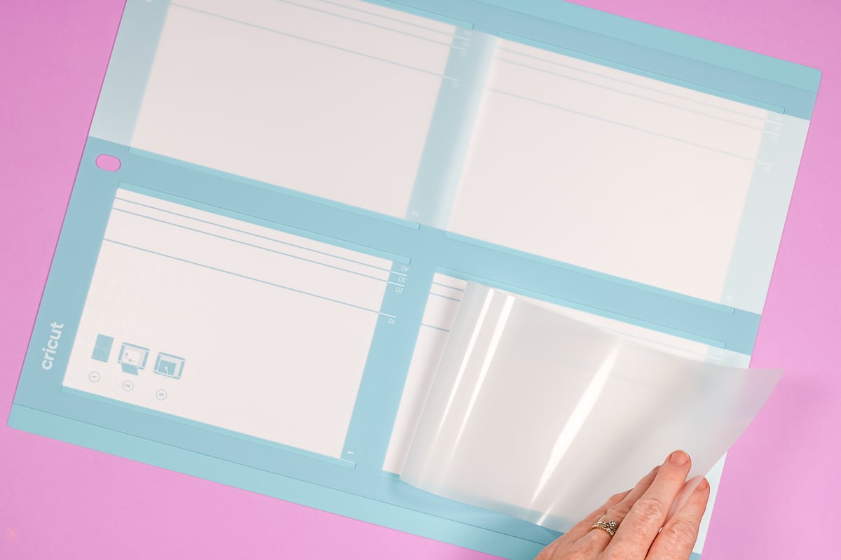 Showing how to remove carrier sheet from Cricut Card Mat 2x2