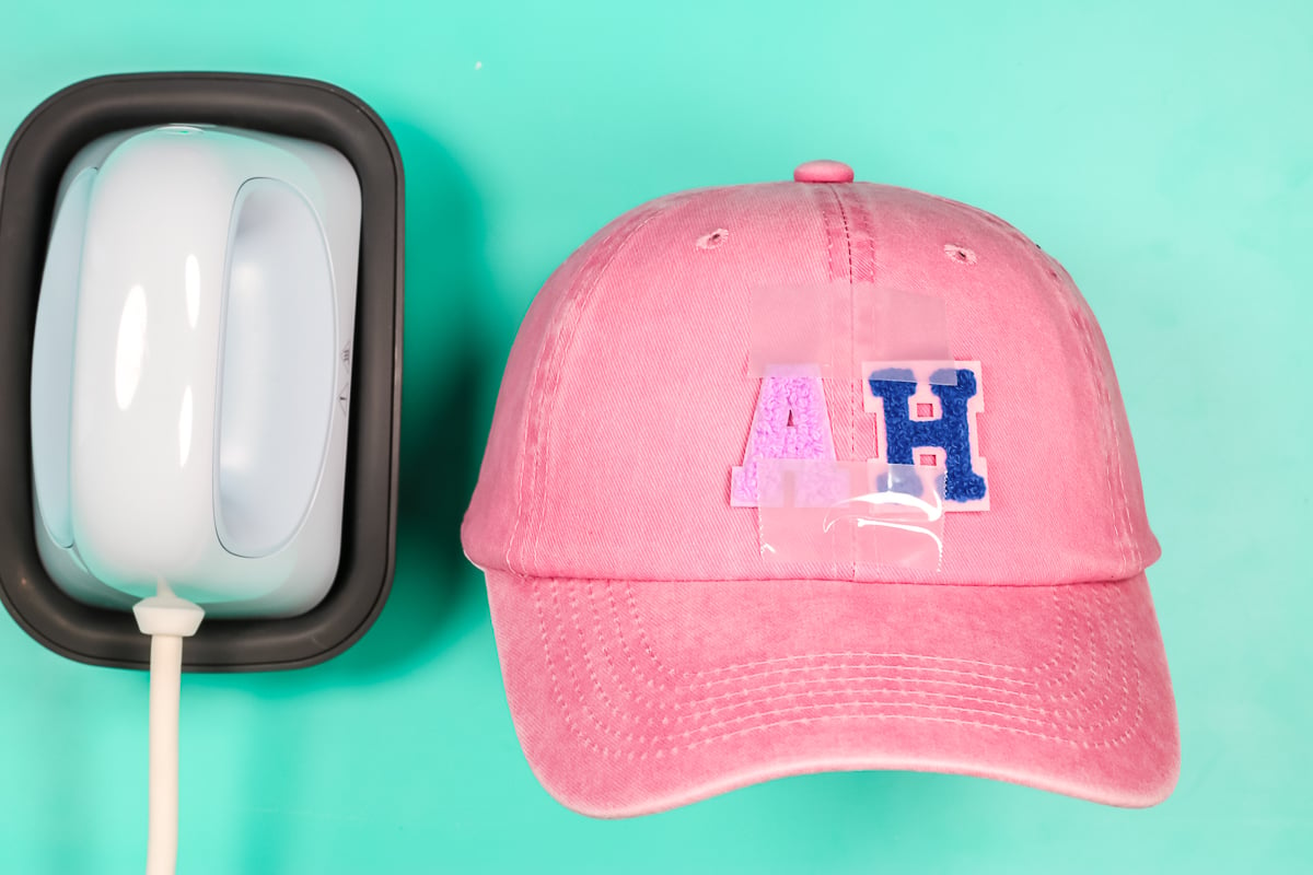 A & H varsity letter patches taped into place on hat.
