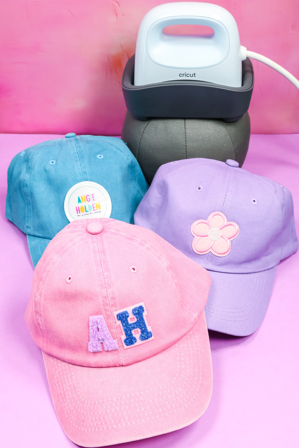 Variety of hats with patches applied with Cricut Hat Press