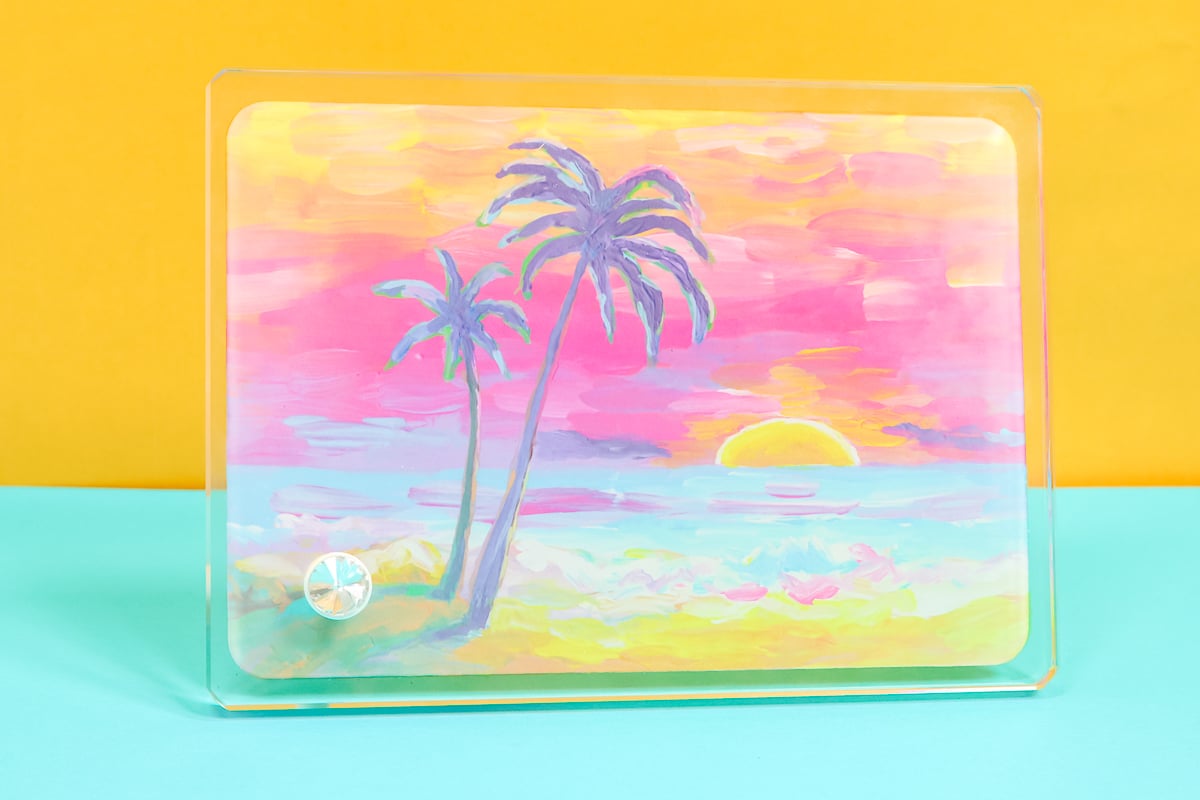 Sublimation on glass frame with palm tree print.