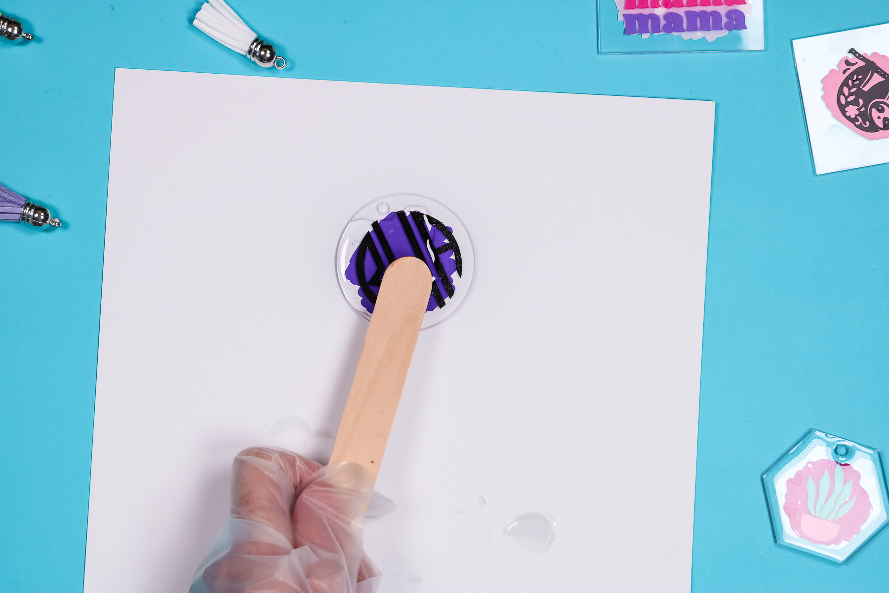 Use an ice cream stick to transfer the UV resin.