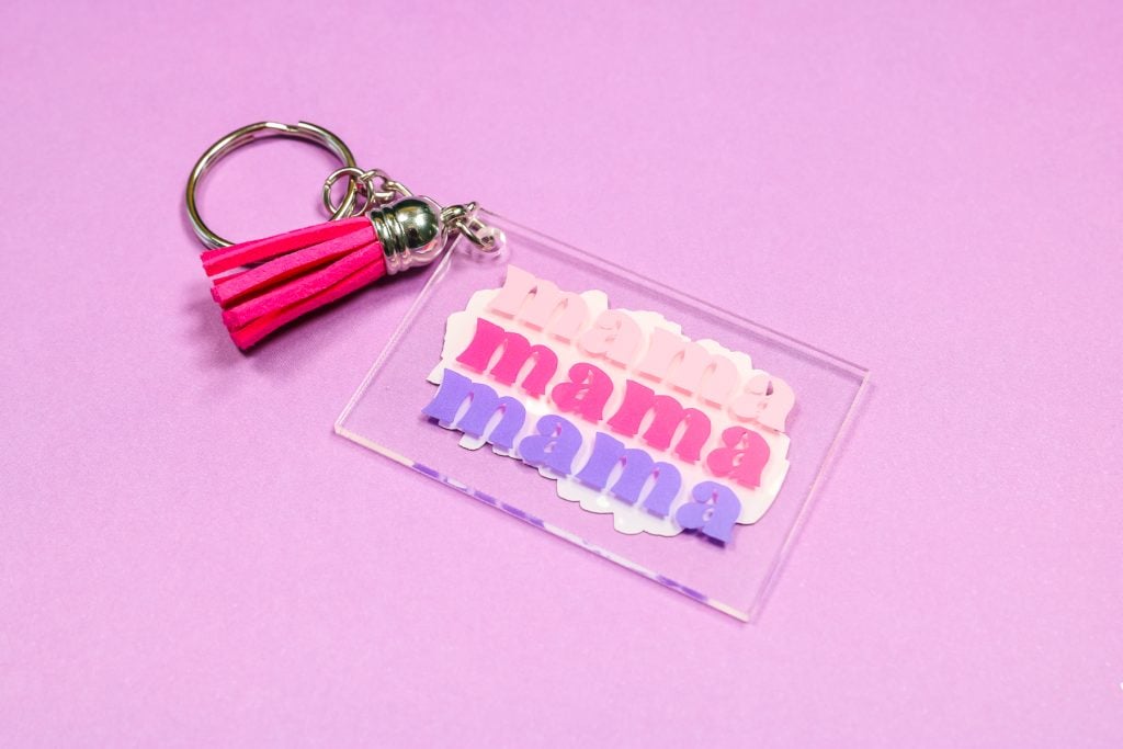 Multi-color vinyl keychain with Mama on it.