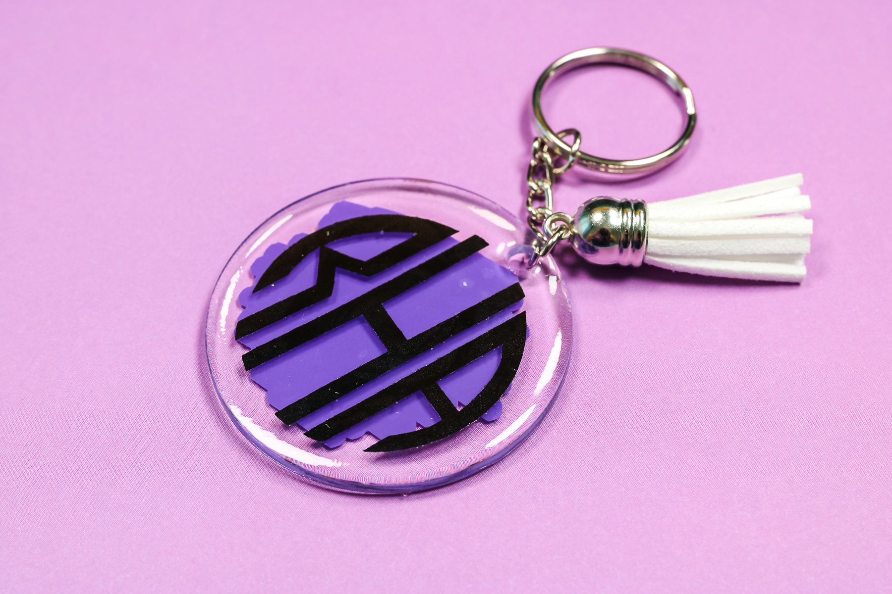 Monogram brush stroke keychain.