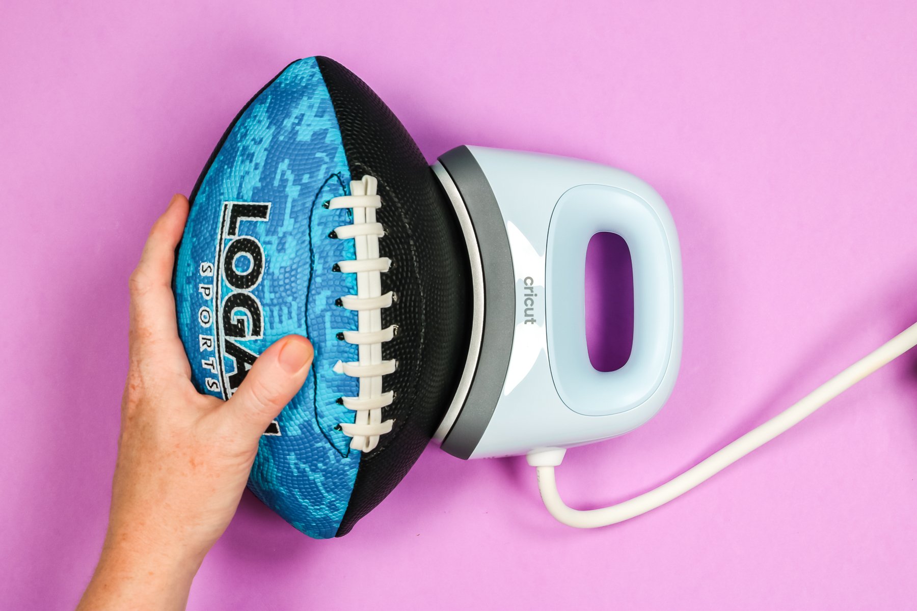 Cricut Hat Press with inflated football.