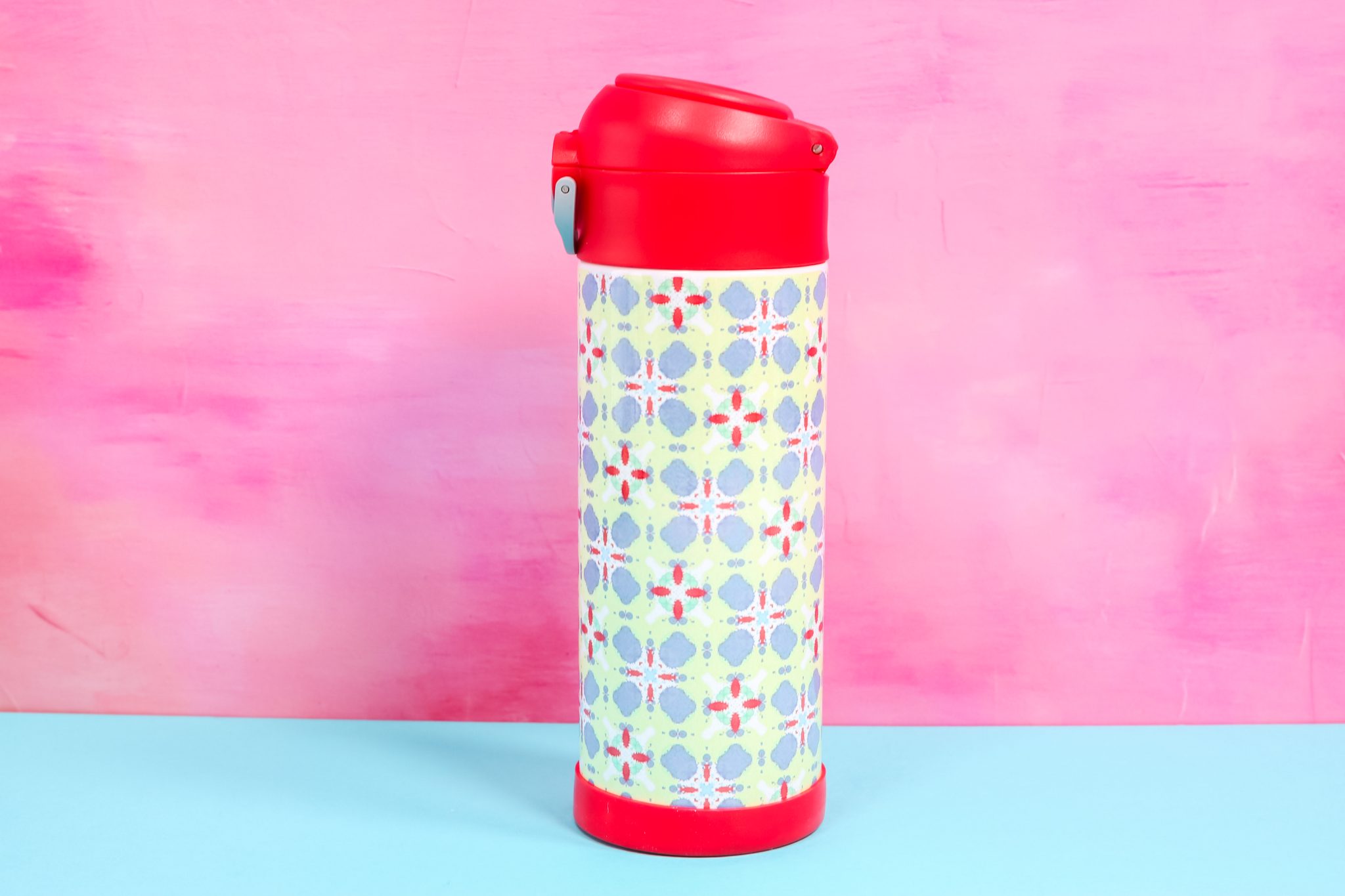 Red water bottle with sublimation wrap.
