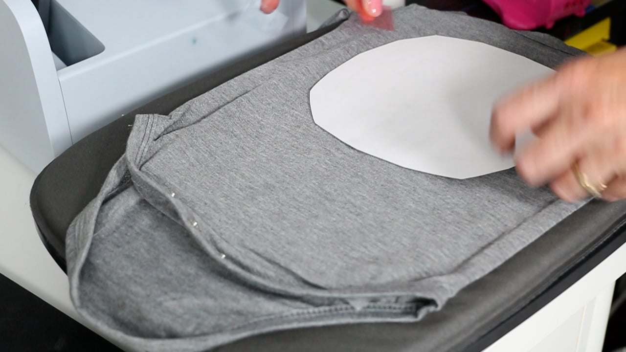 Adding sublimation print to grey shirt.