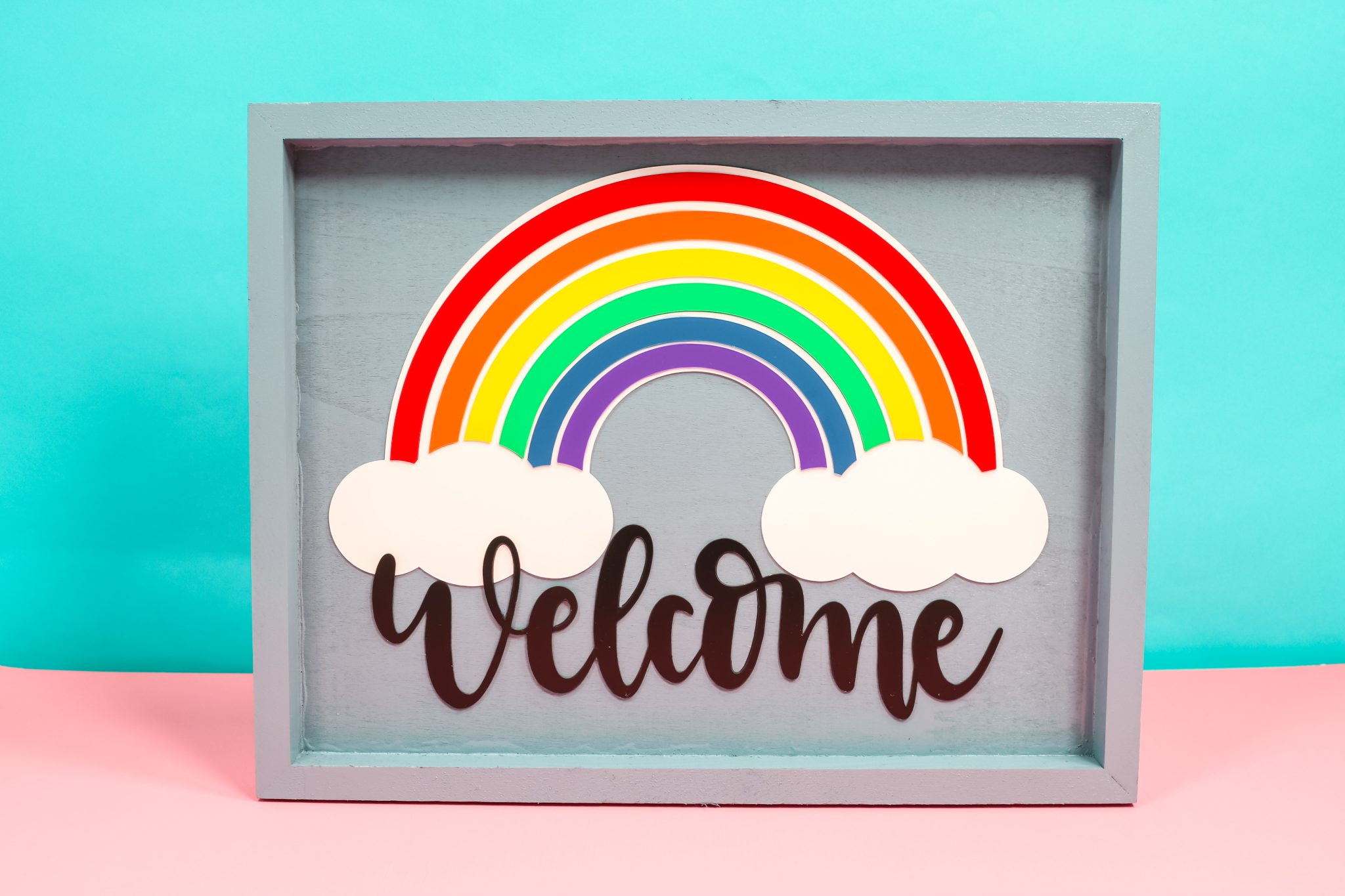 Finished welcome rainbow sign made with Cricut plastic.