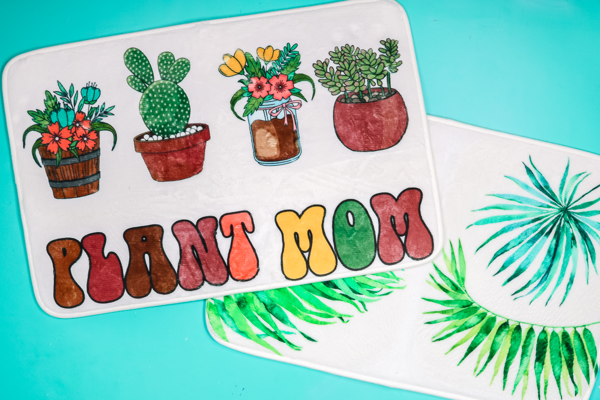 Sublimation door mats with palm leaves and plants.
