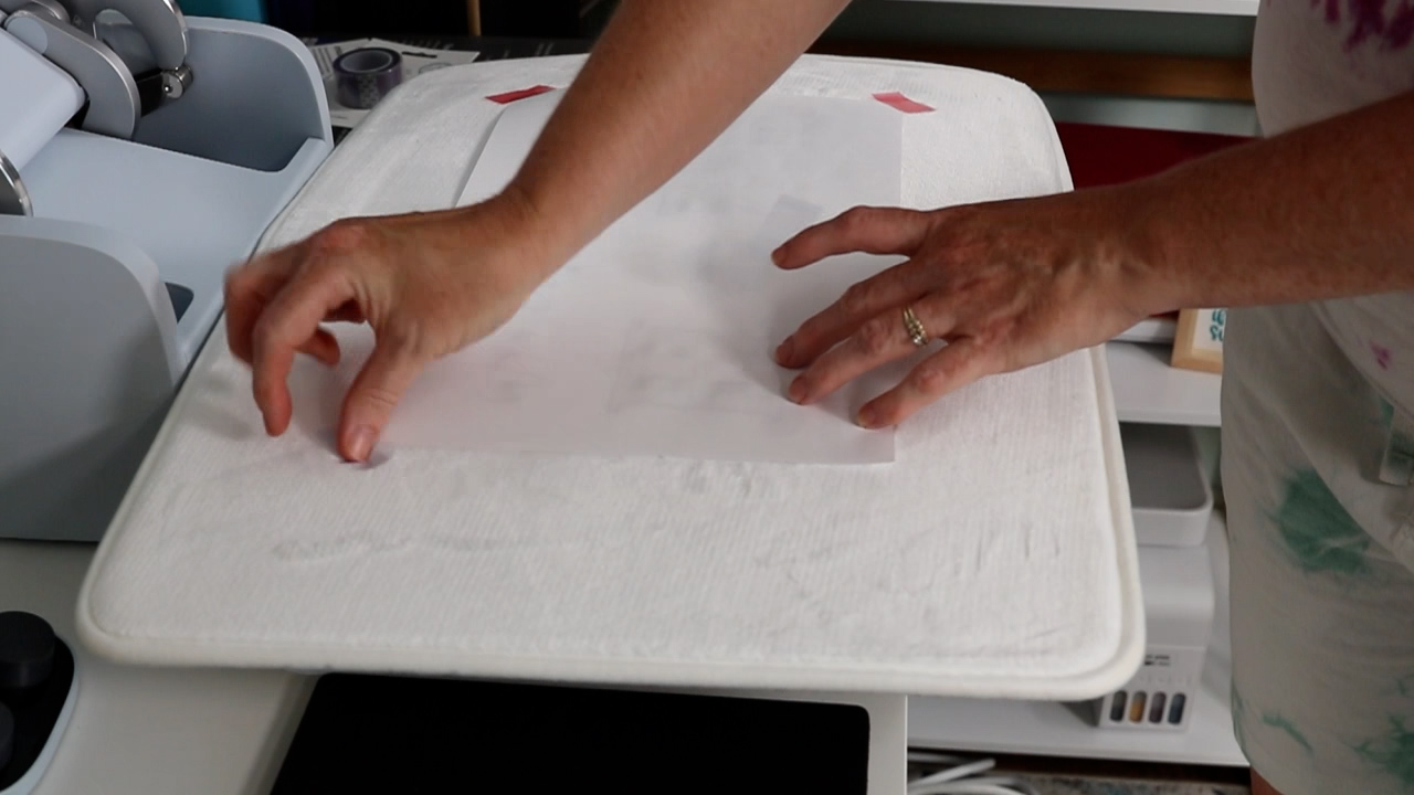 Use heat resistant tape to hold sublimation print in place.