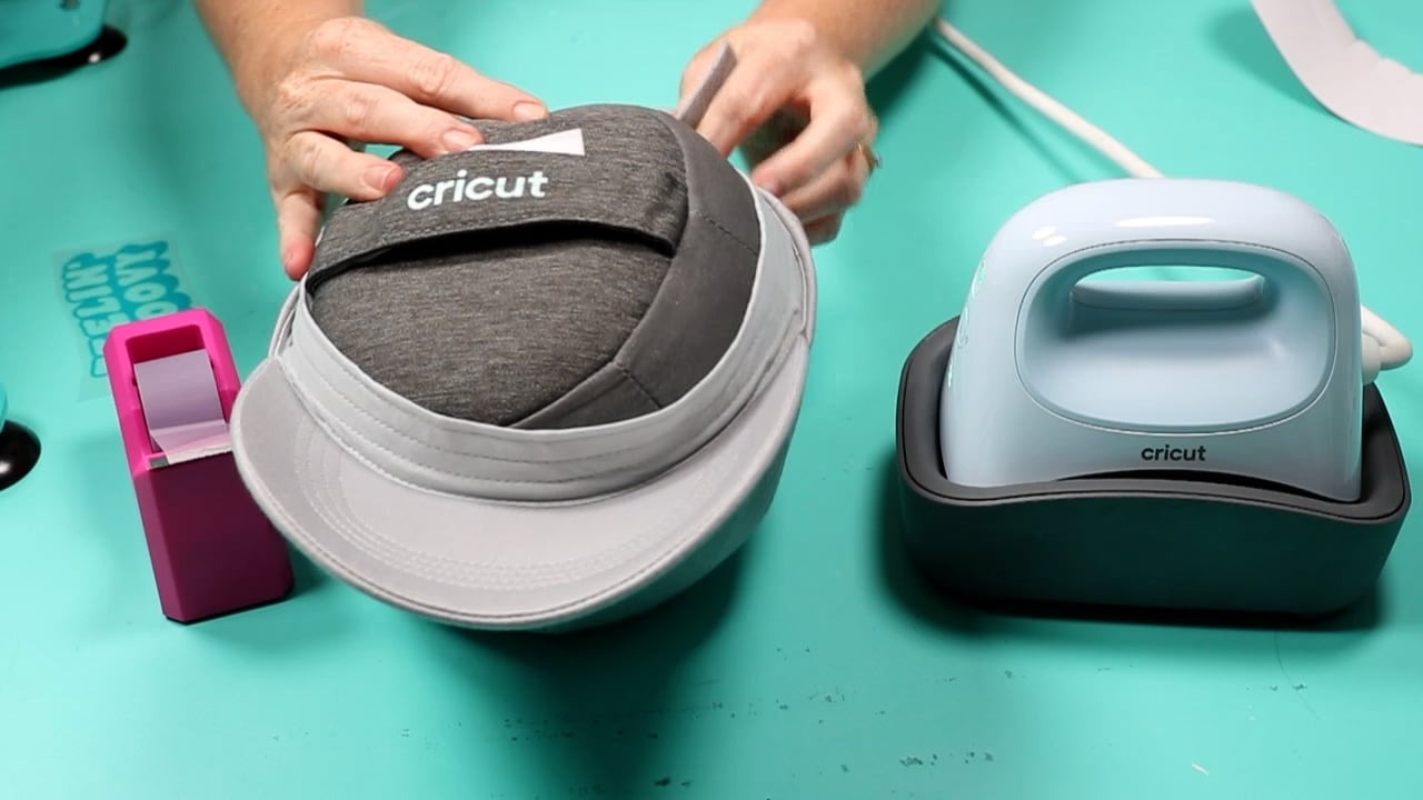 Inserting Cricut Hat Form into hat.