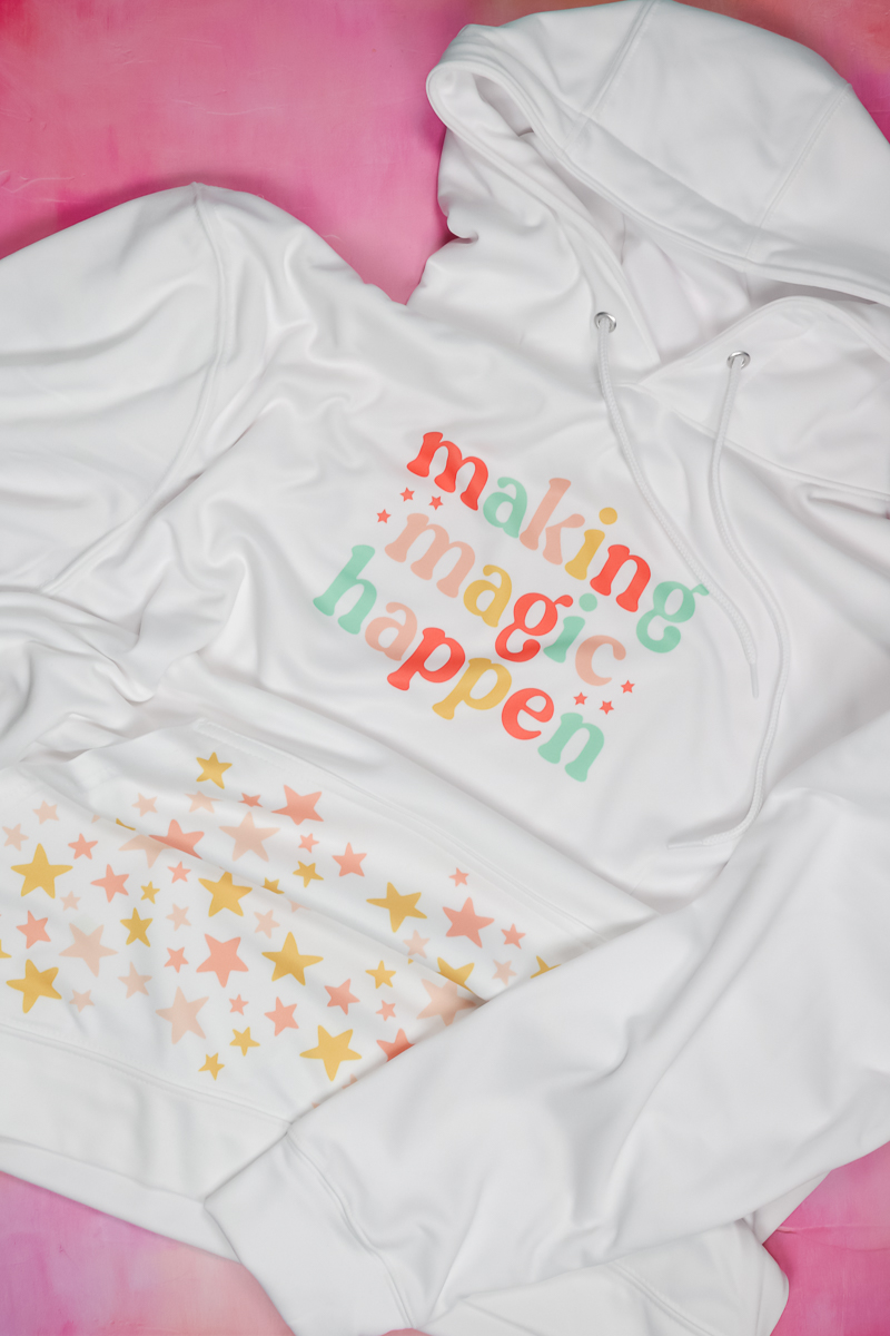 Make the magic happen the sublimation image on the hooded t-shirt.