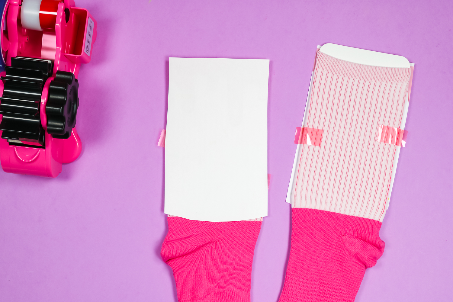 Pink crew socks with sublimation image taped to top.