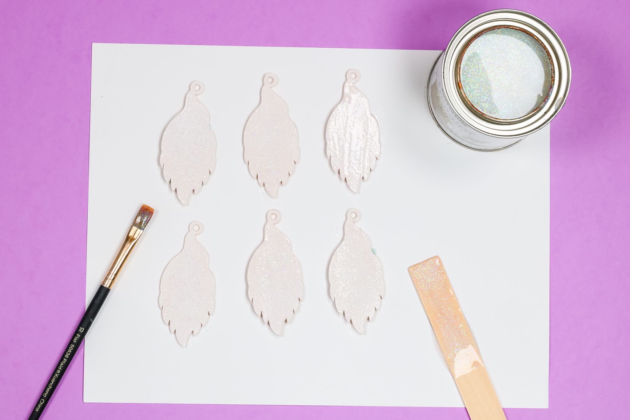 adding glitter paint to earrings