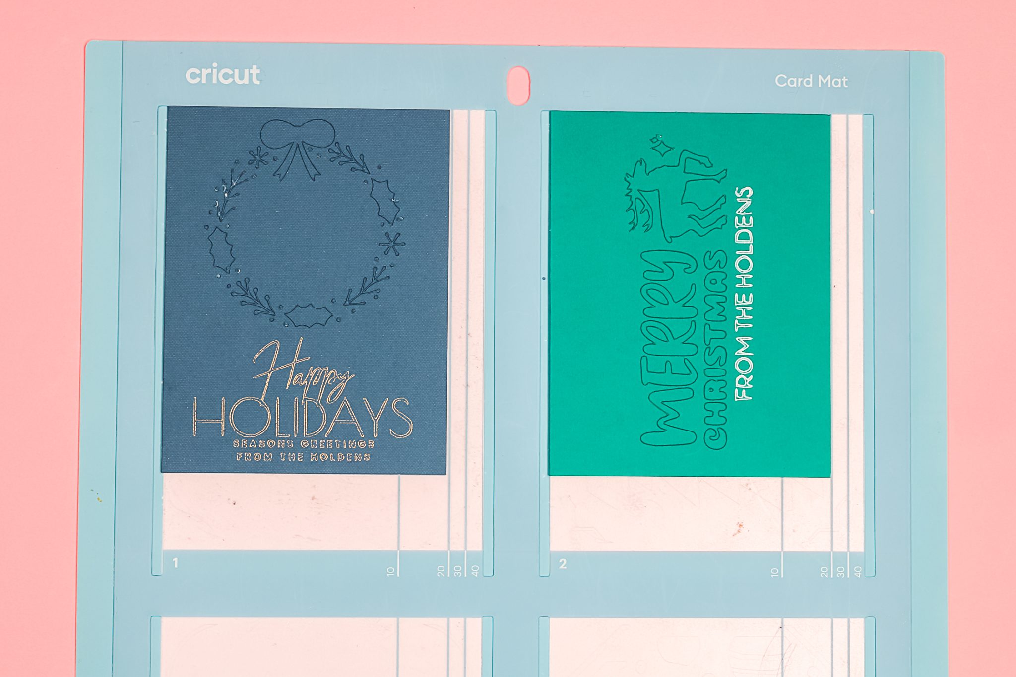 Cutaway and Insert Cricut Christmas cards on mat.