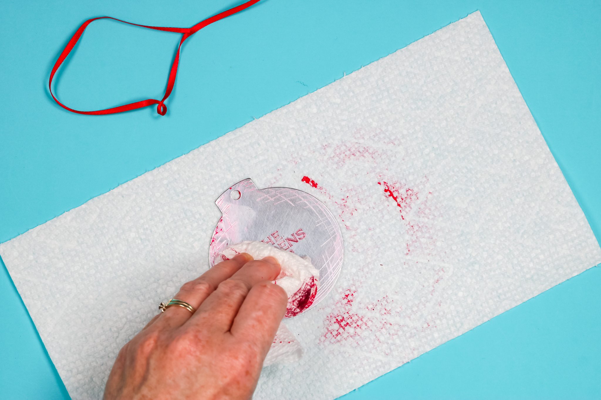 Removing stamping ink from engraved ornament.