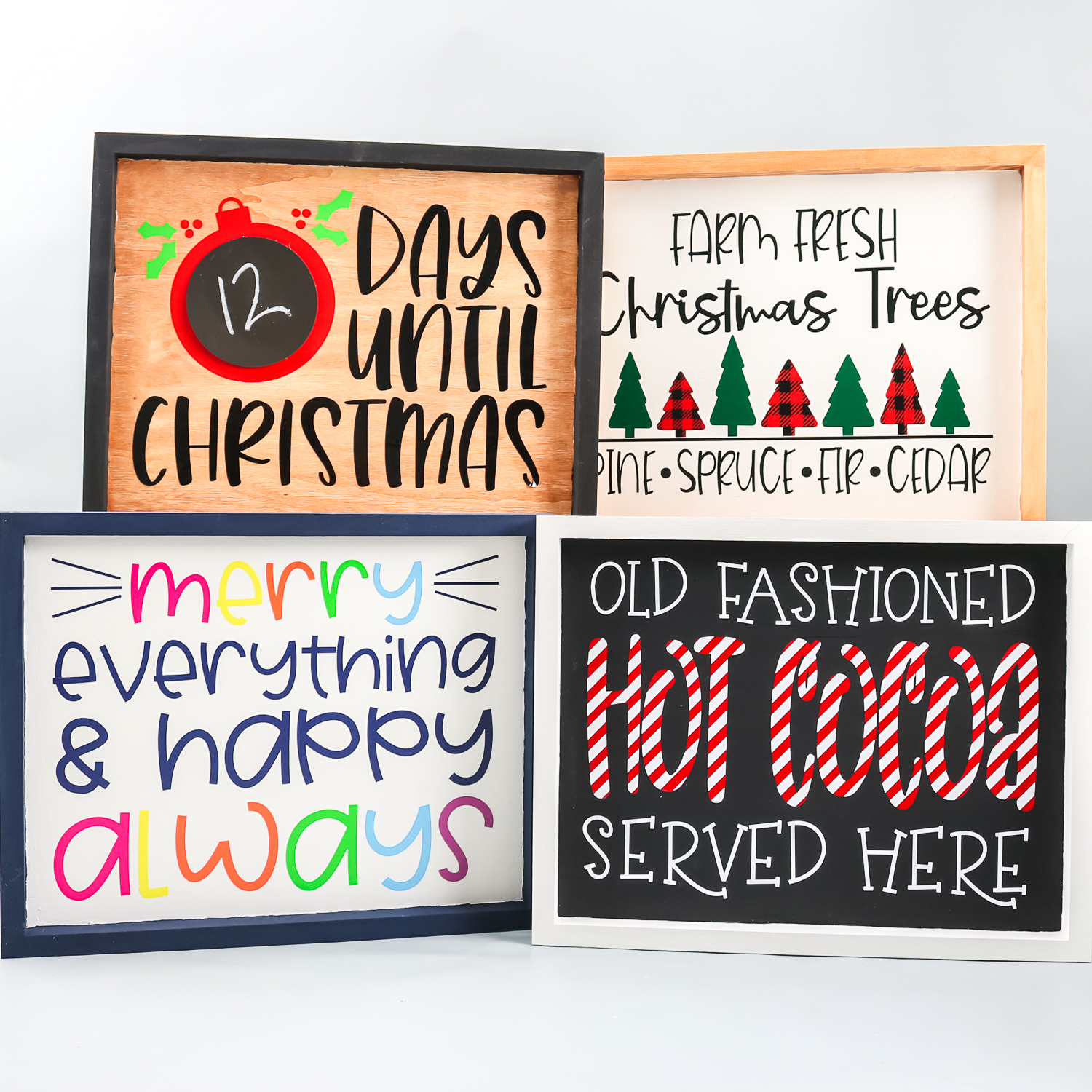 Cricut signs with layered vinyl for the holidays.