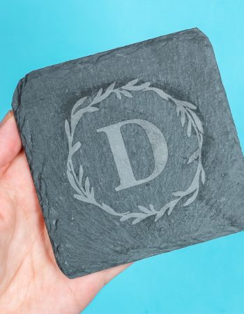 Etched slate with monogram design applied.