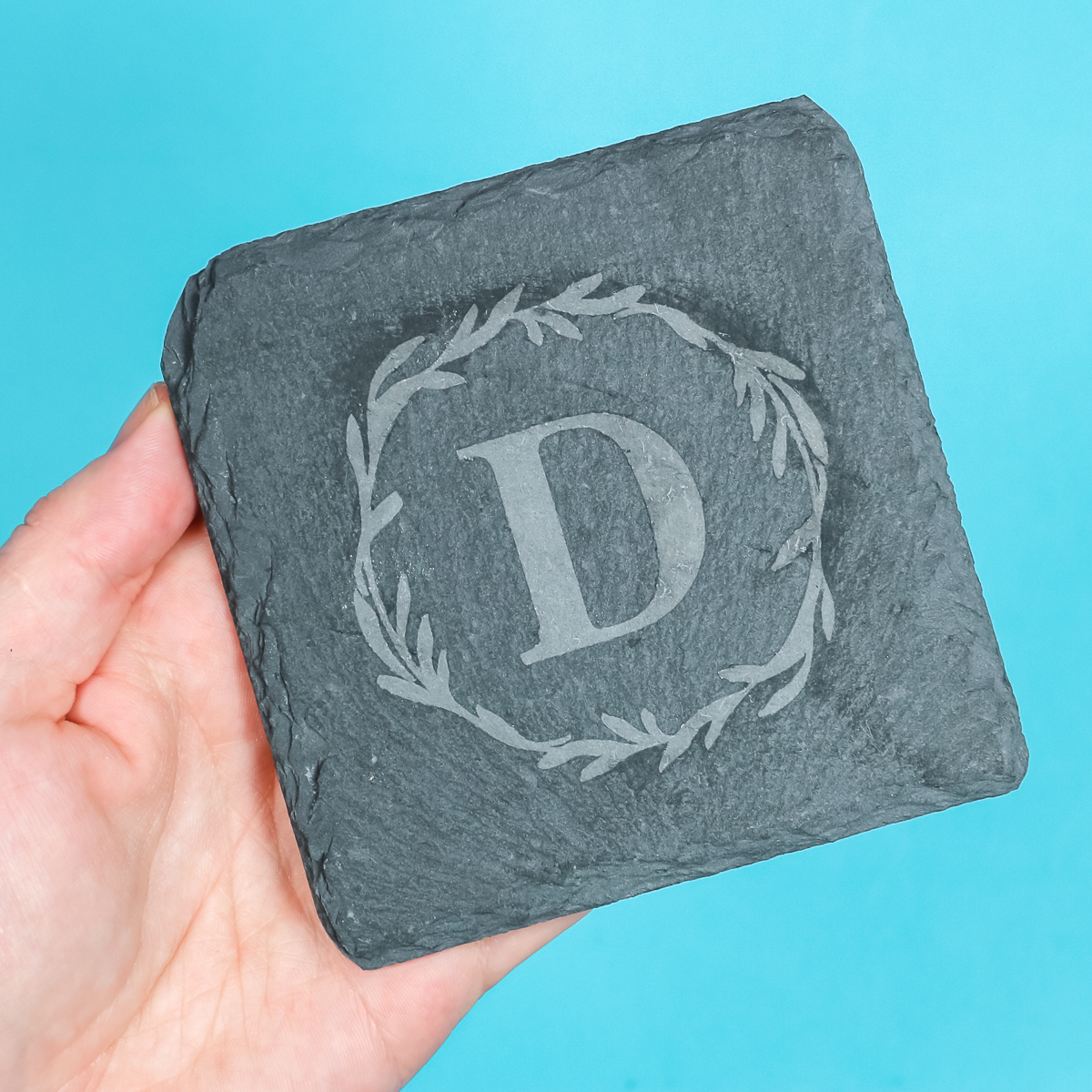 Etched slate with monogram design applied.