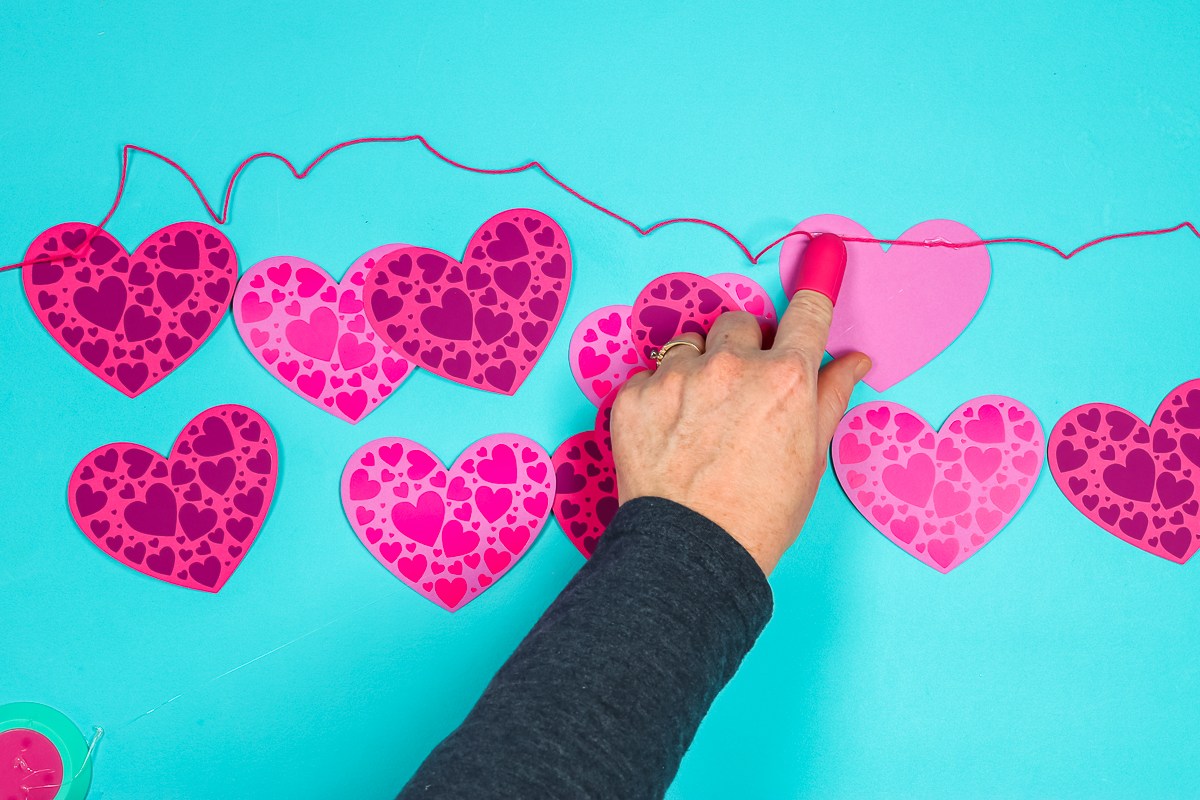 Use hot glue to attach twine to make banner.