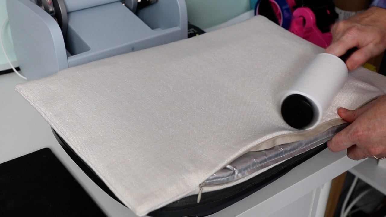 Lint roll the surface after pre-pressing.