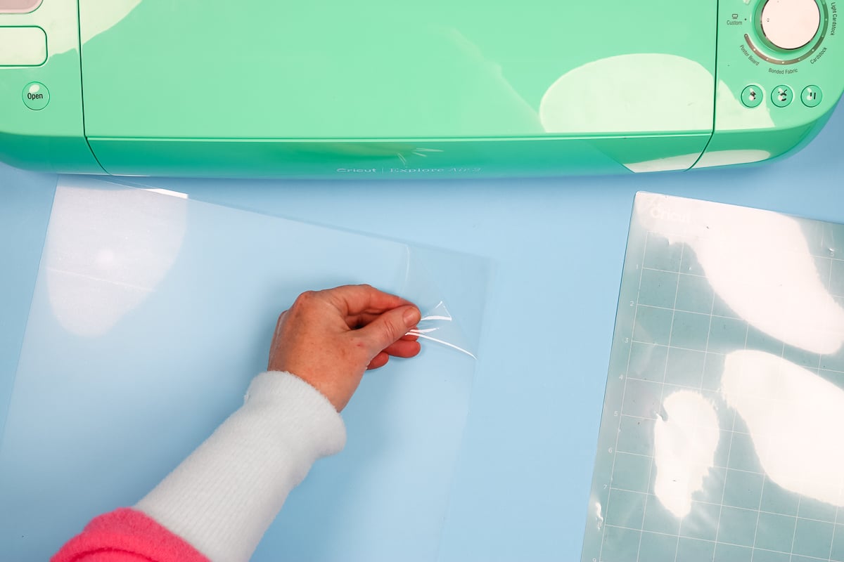 removing protective film from stencil sheet