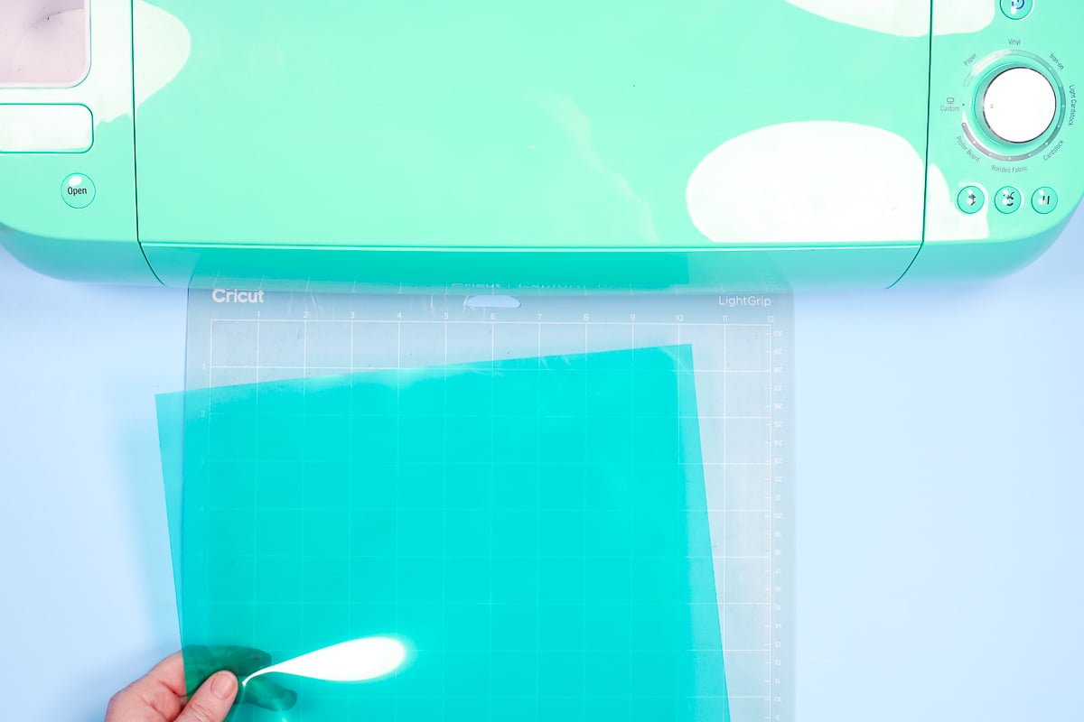 Apply heat mask to cutting mat carrier sheet down.