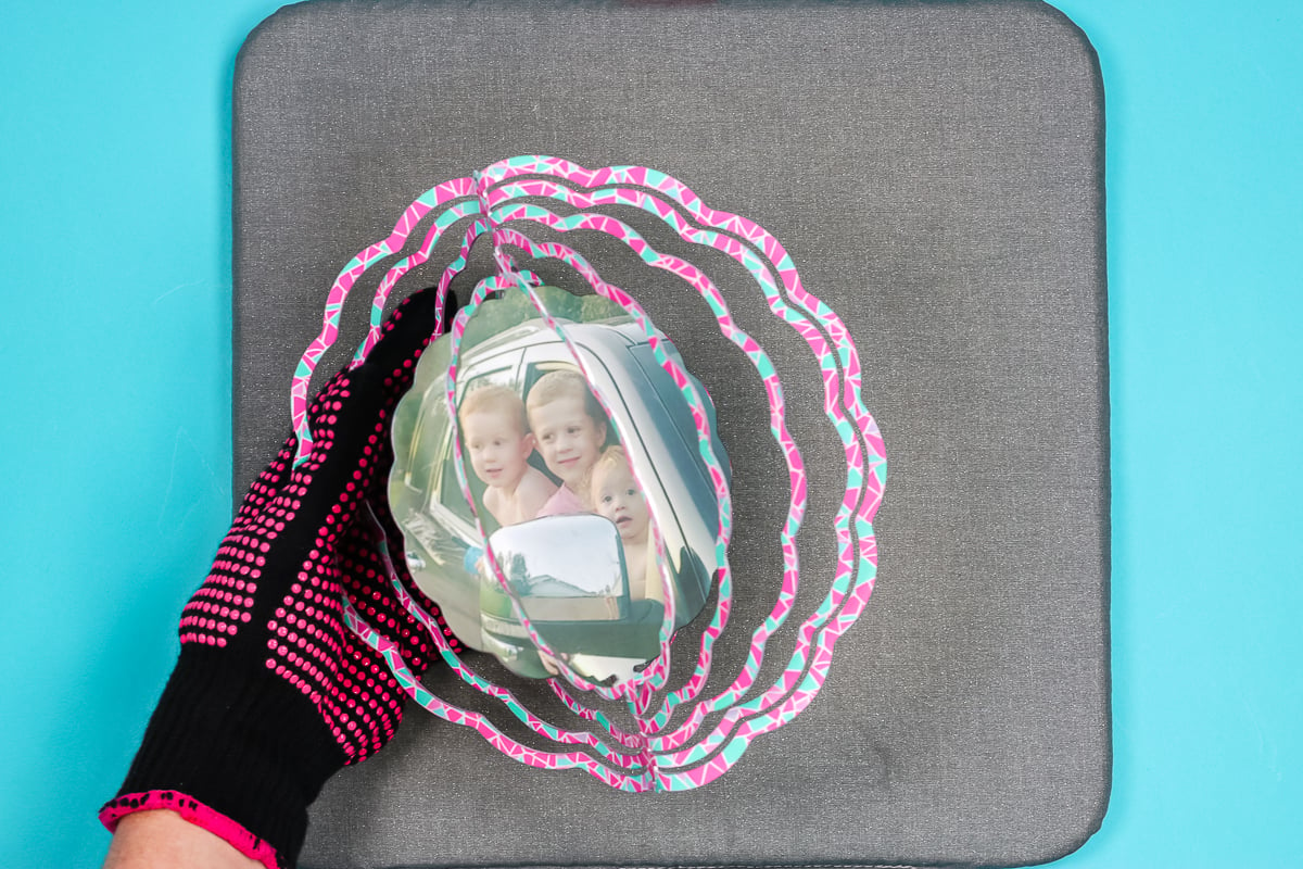 Bend side rings to create wind spinner.