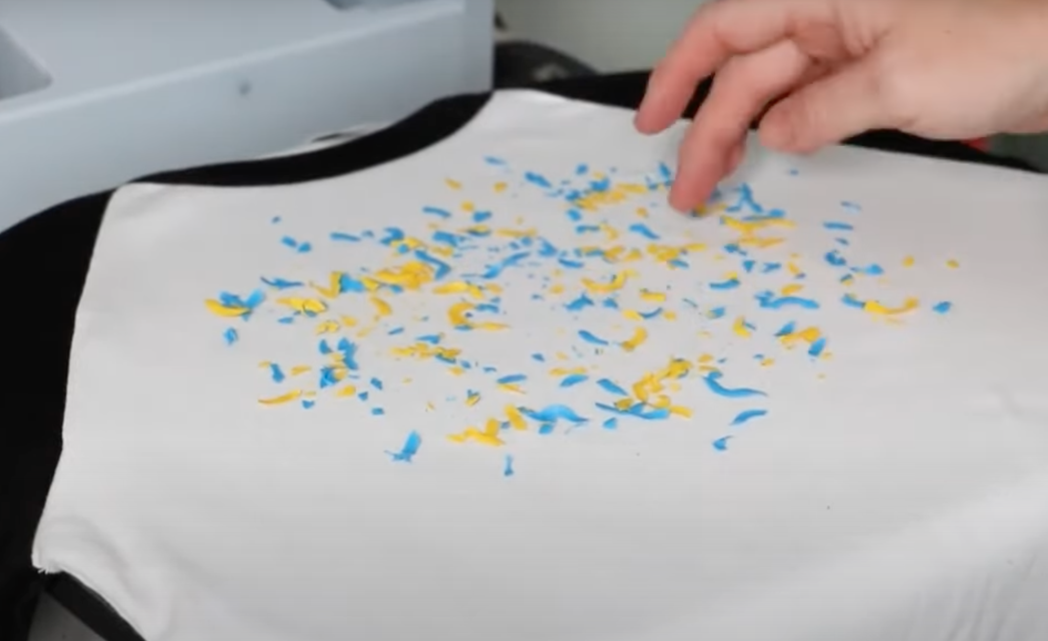 Add screen print confetti to t-shirt.