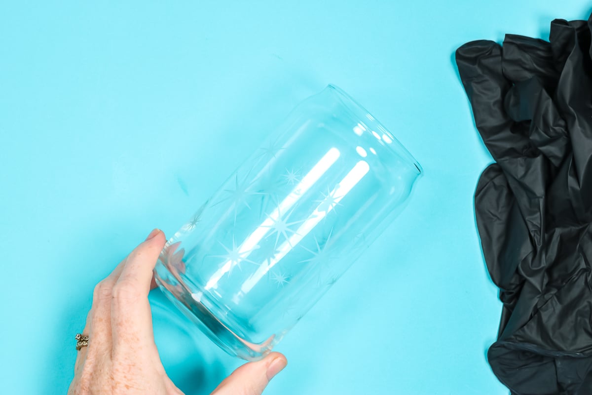 Glass can with glass etched stars without color applied.