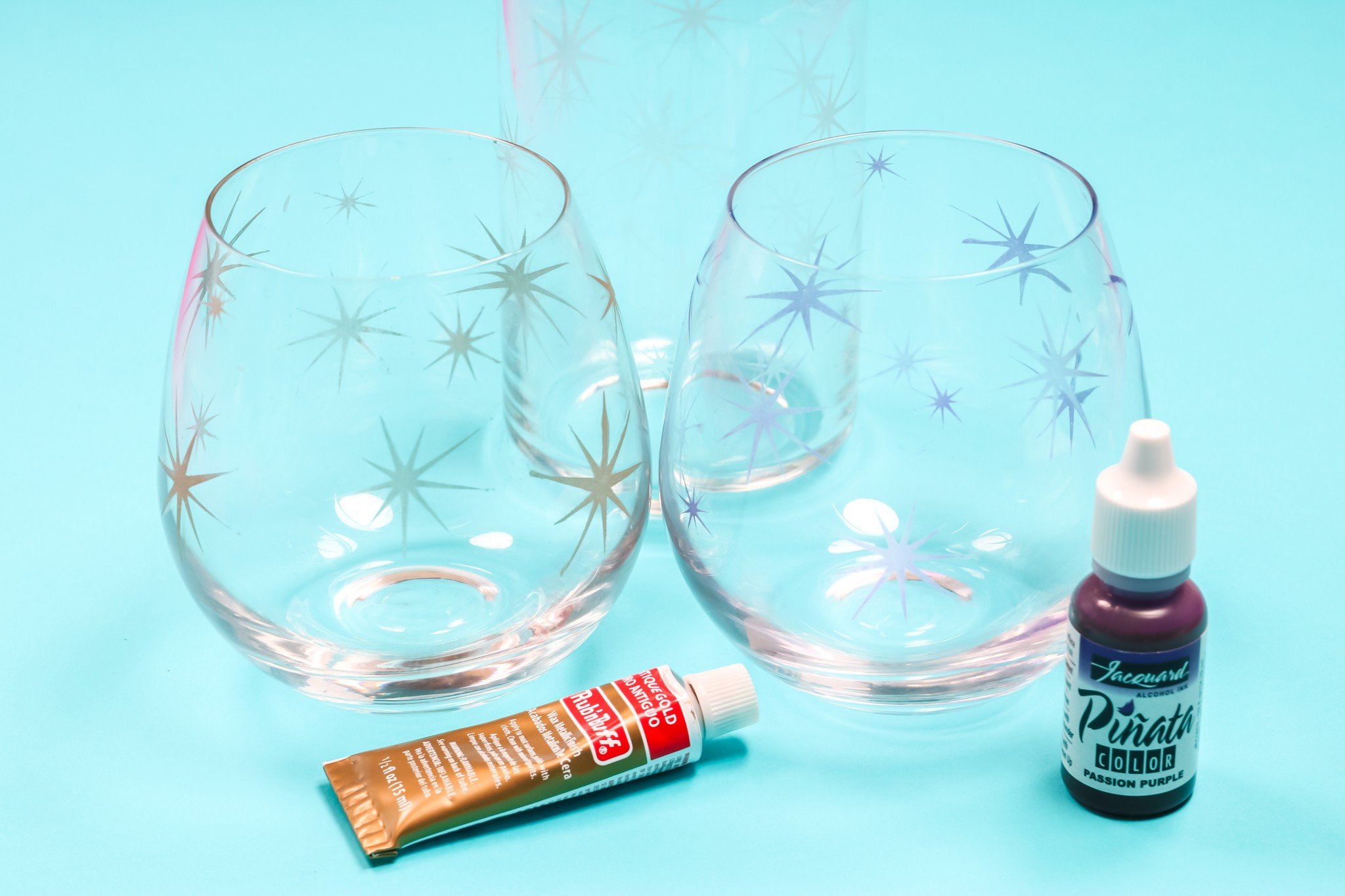 Finished color etched glass wine glasses.