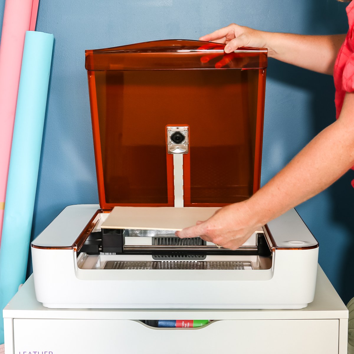 angie holden adding material to a glowforge aura