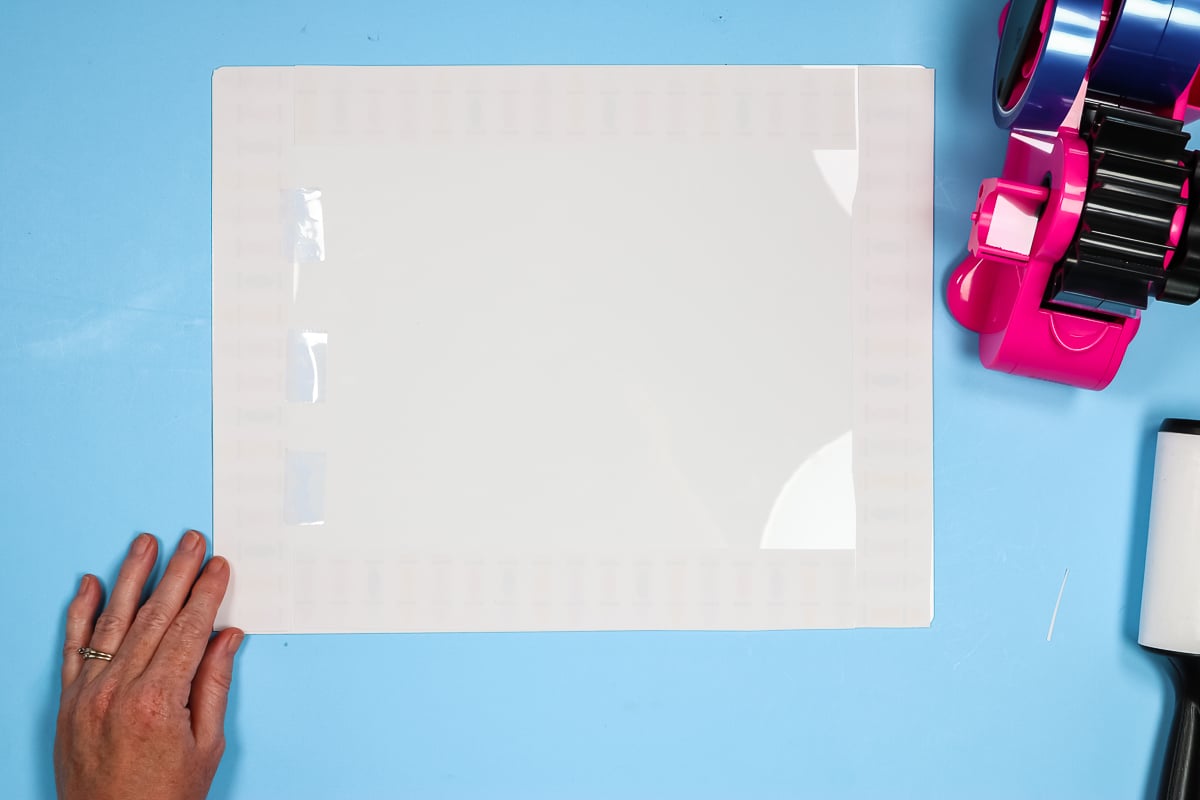 Tape sublimation print onto dry erase board.