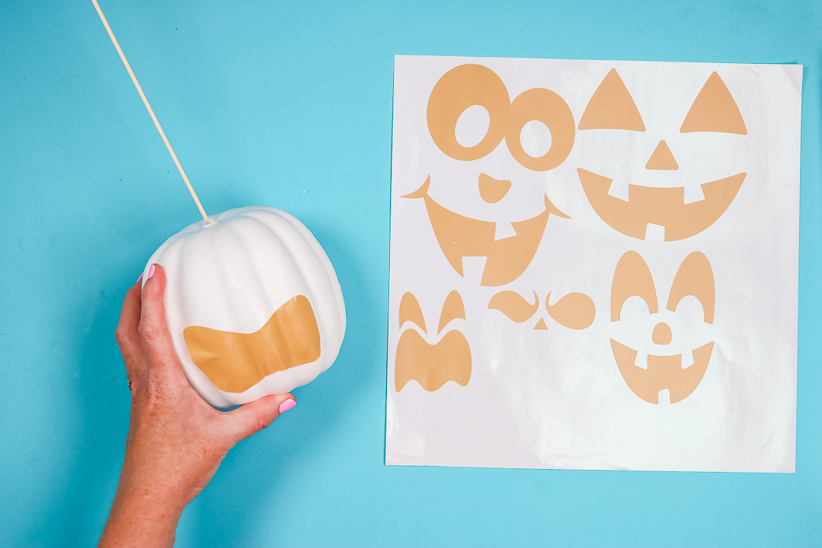 Lift vinyl and apply to white pumpkin.