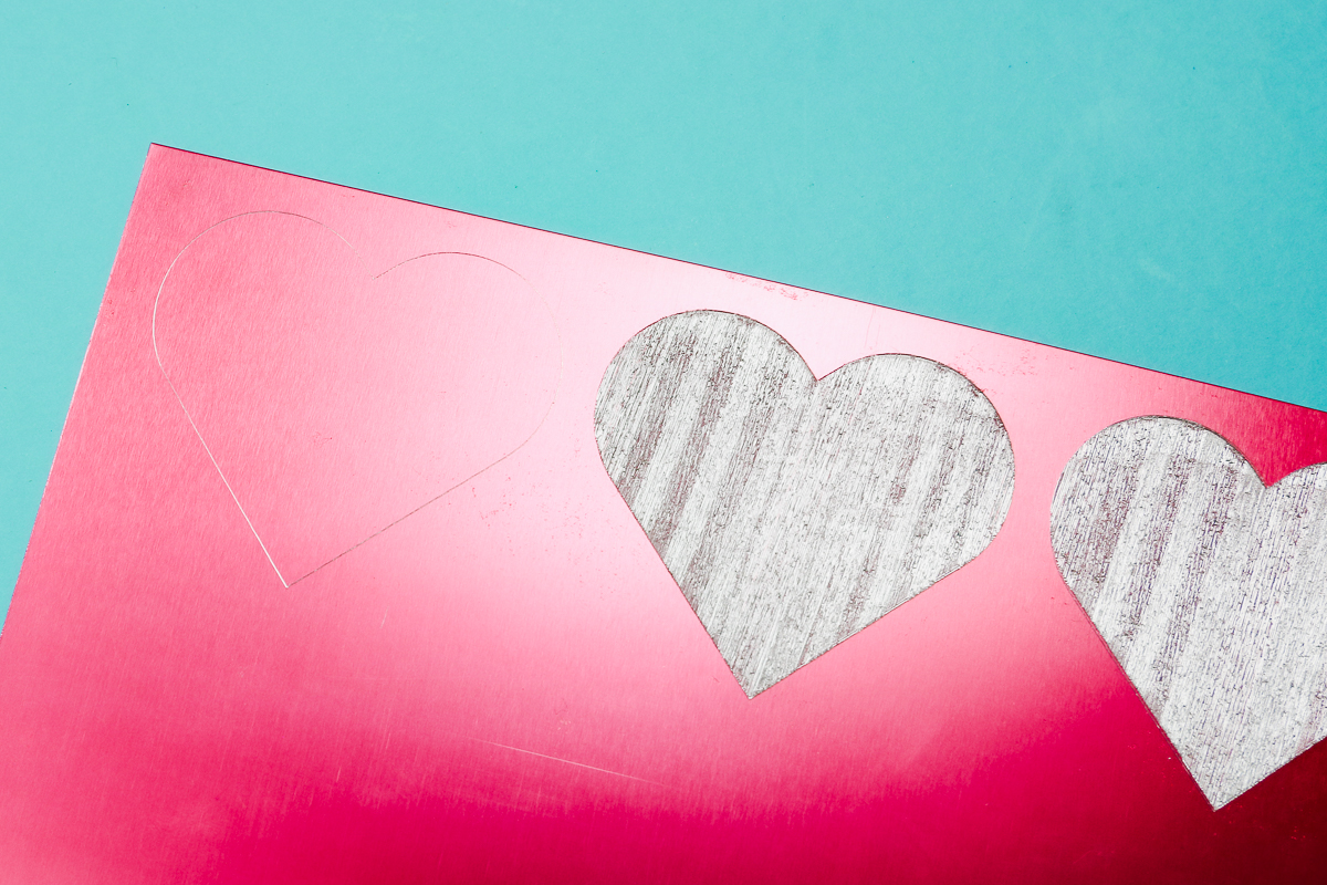 Close up of pattern fill engraved hearts.