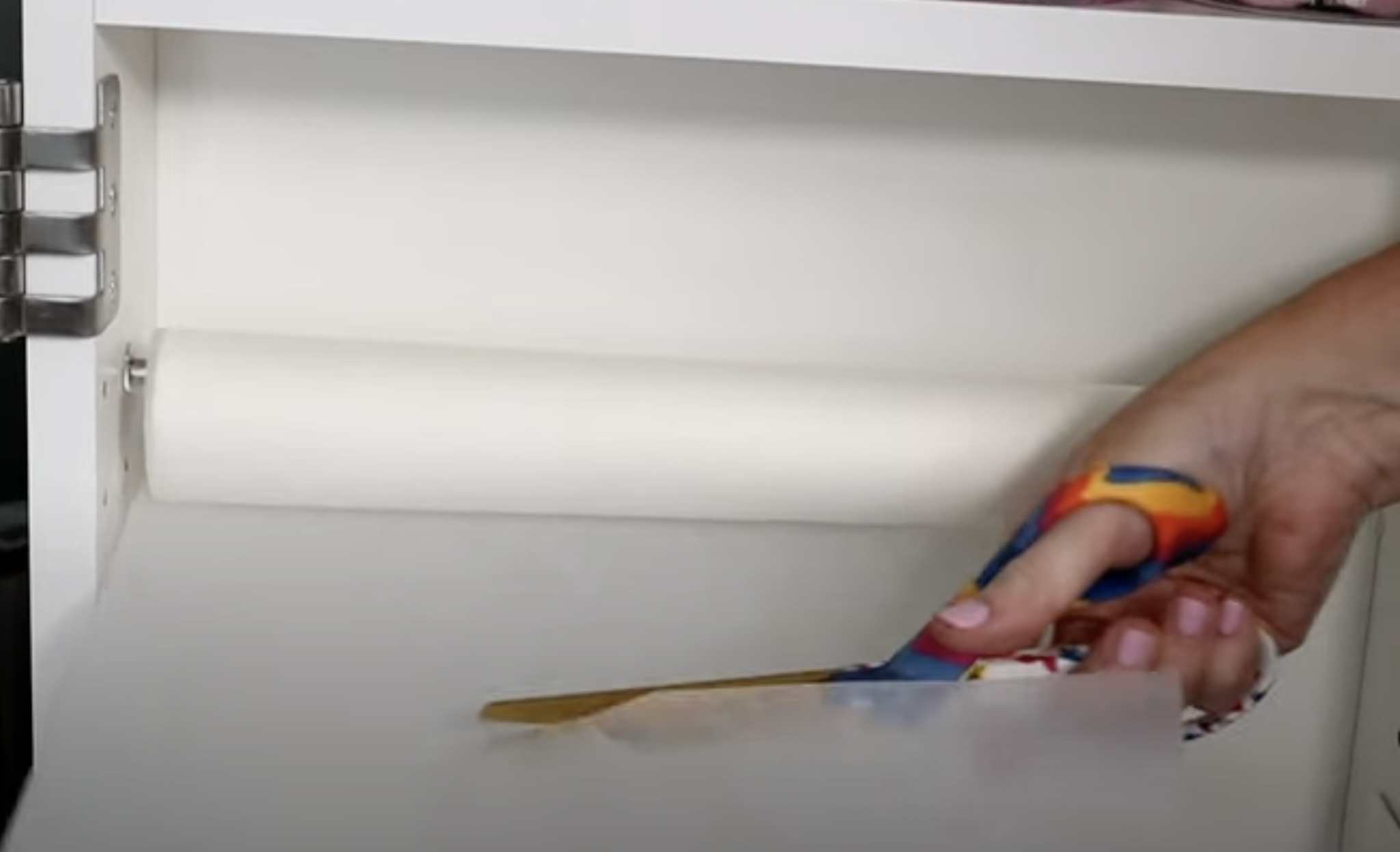 Use scissors to trim sublimation protective paper from roll.