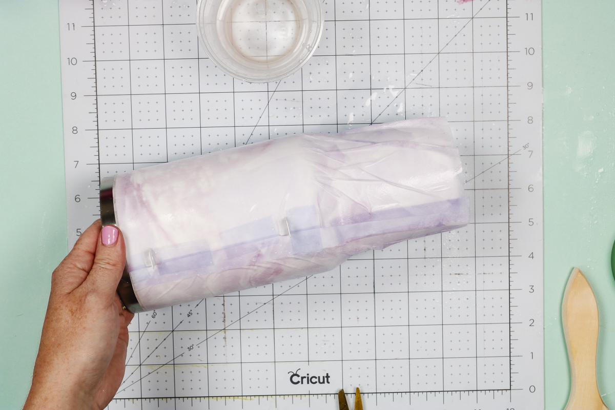 Smooth hydro sublimation sheets with water and paintbrush.
