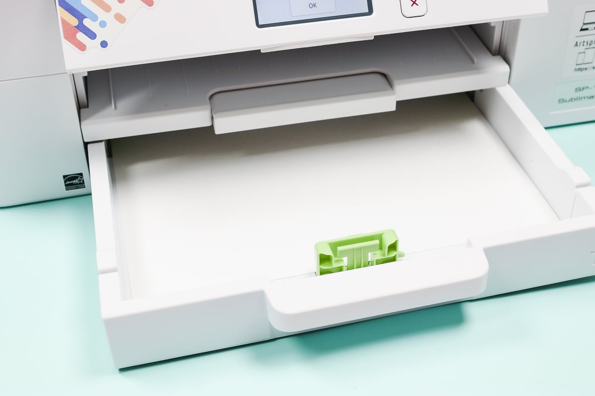 Adjust printer tray to fit paper size.