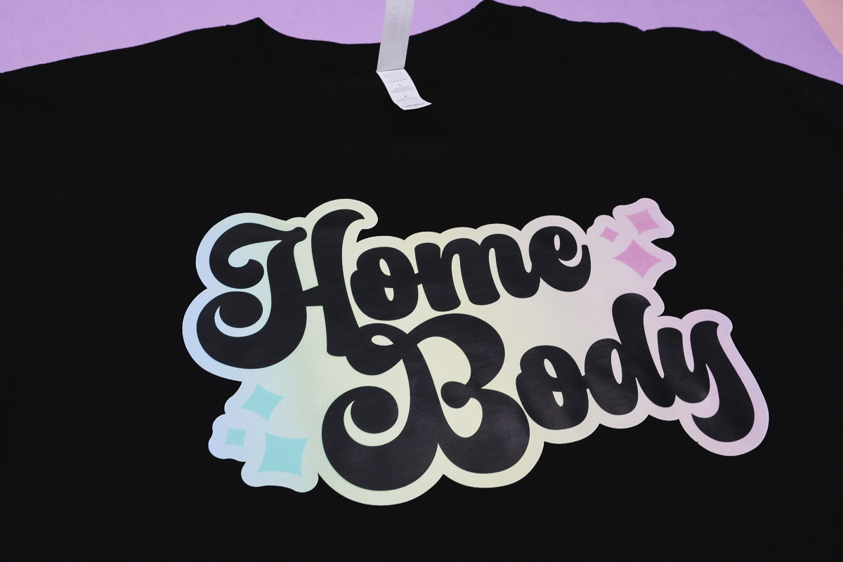 Black shirt with home body design on it.