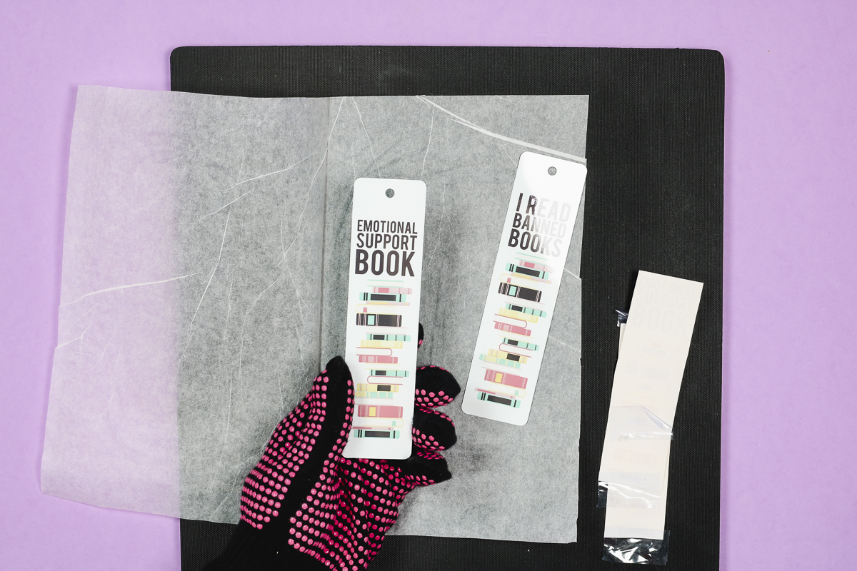 Remove sublimation print to reveal design on bookmark.